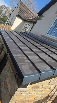 After — New grey EPDM flat roof on rear extension
