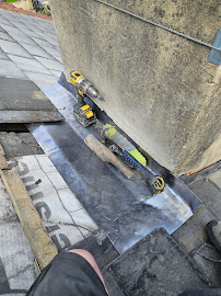 Before — Crumbling chimney mortar and failed flashing