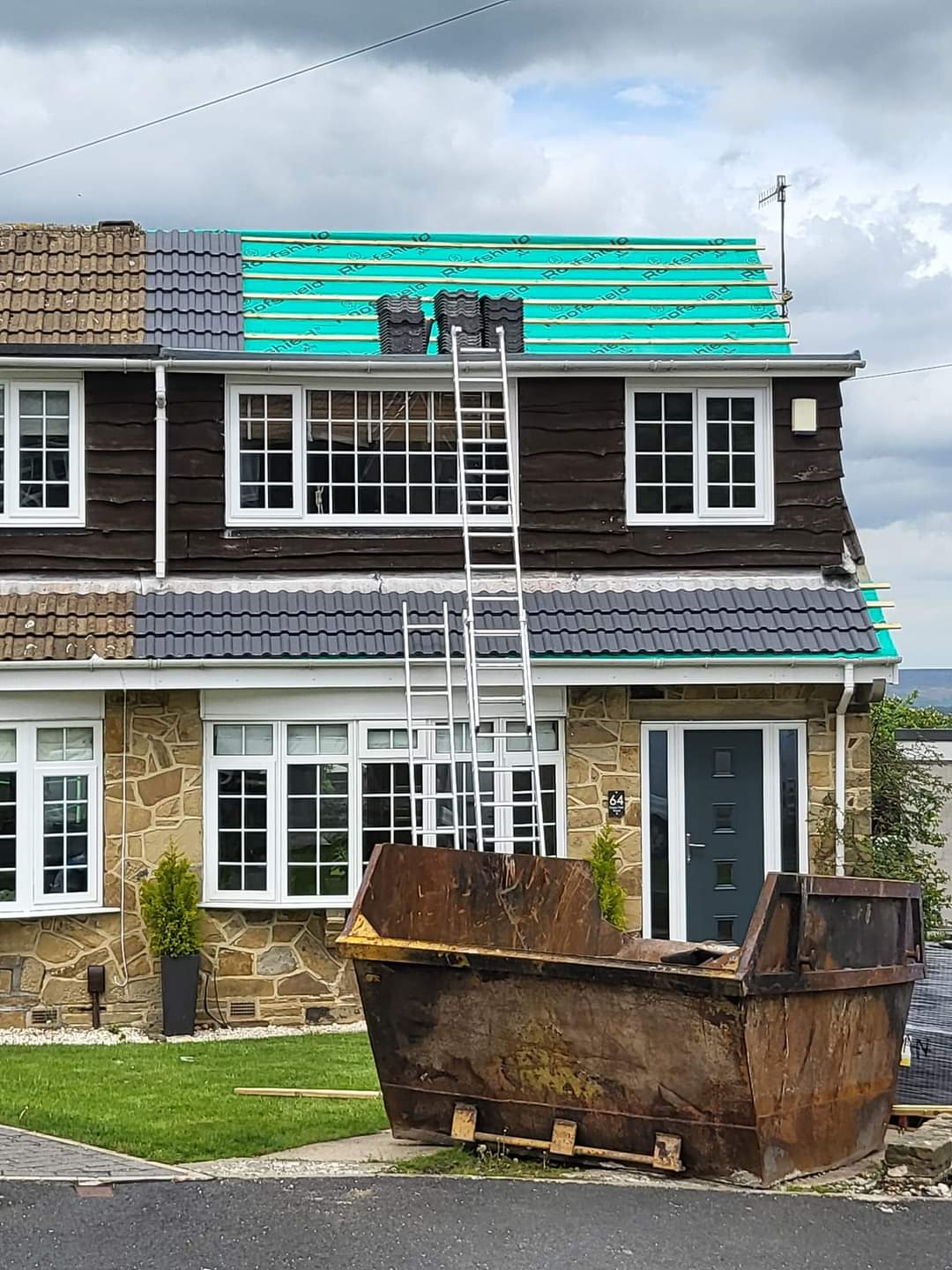 Before — Worn, moss-covered roof needing full replacement