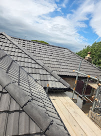 Completed concrete-tile re-roof on a Bradford semi-detached house, photographed after scaffolding removal. Leafield Roofing, Eccleshill BD2