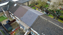 Drone aerial photograph of a completed Leafield Roofing slate installation on a Bradford property — sharp valleys, clean ridge tiles
