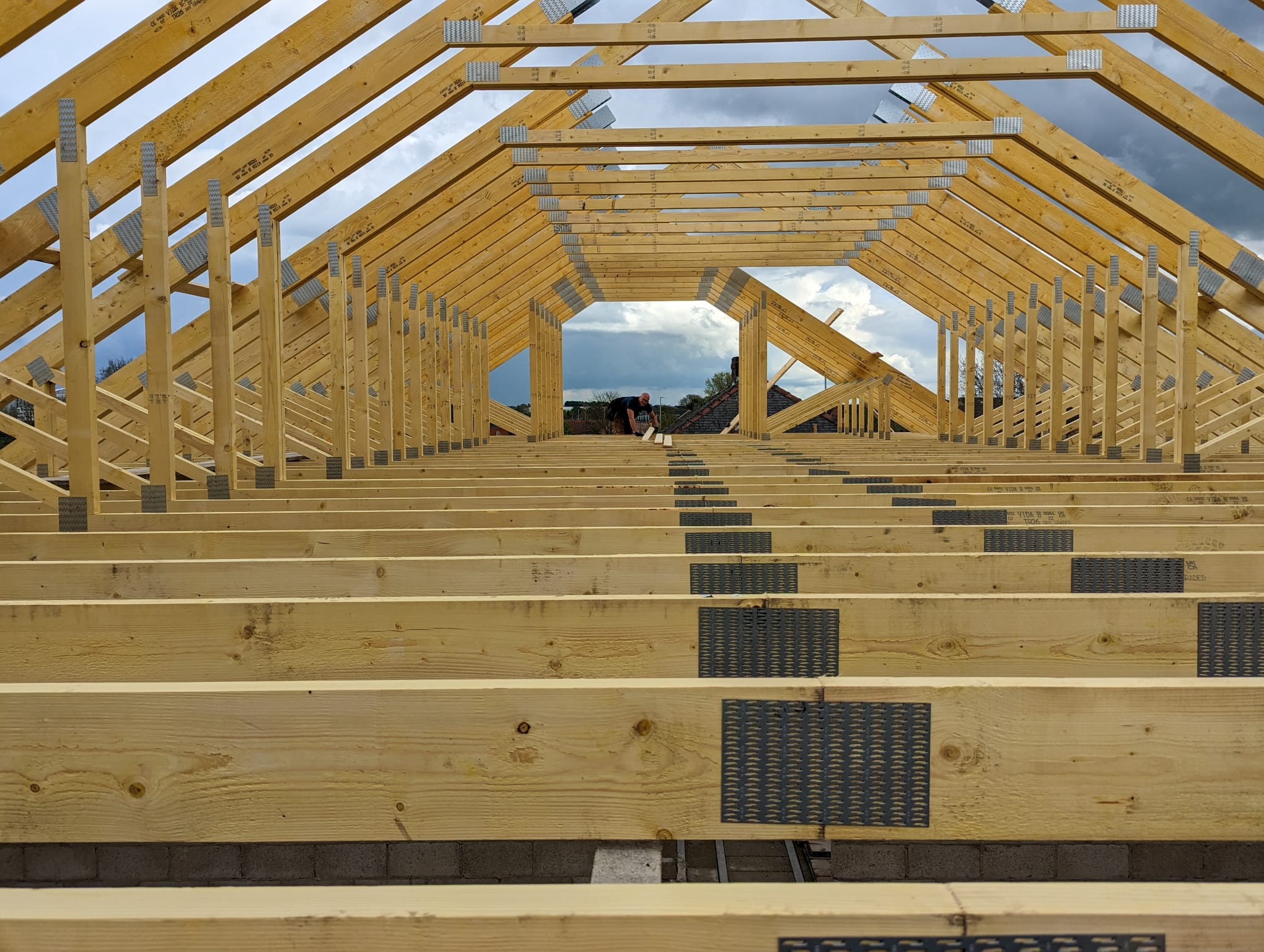 Interior view of new timber roof frame with purlins and trusses during a Bradford extension build by Leafield Roofing